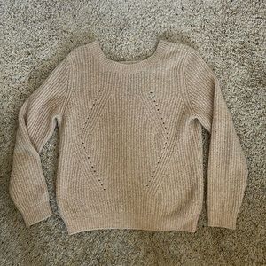 Light rose colored sweater with partially open back